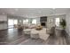 Open concept living room showcasing a fireplace and lots of natural light at 6254 E Winchcomb Dr, Scottsdale, AZ 85254