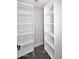 Walk-in closet with white shelving provides ample and organized storage space at 6254 E Winchcomb Dr, Scottsdale, AZ 85254