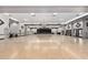 Spacious ballroom featuring a polished wood floor, stage, and elegant chandelier lighting at 6621 S Coral Gable Dr, Chandler, AZ 85249