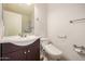 Bathroom featuring a modern toilet and vanity with updated fixtures at 6621 S Coral Gable Dr, Chandler, AZ 85249