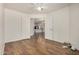 Bedroom with wood-look floors and an open doorway to the kitchen at 6621 S Coral Gable Dr, Chandler, AZ 85249