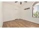 Bright bedroom featuring wood floors, vaulted ceilings, and a large window for natural light at 6621 S Coral Gable Dr, Chandler, AZ 85249