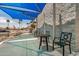 Covered patio with tables and chairs for residents to gather at the Sun Bird community center at 6621 S Coral Gable Dr, Chandler, AZ 85249