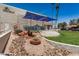 Exterior community view with landscaped area and covered patio seating at the Sun Bird community center at 6621 S Coral Gable Dr, Chandler, AZ 85249