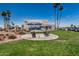 Well-maintained grounds surround the Sun Bird community center with comfortable outdoor seating at 6621 S Coral Gable Dr, Chandler, AZ 85249