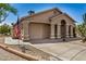 Charming home with a covered entryway, desert landscaping, and an American flag at 6621 S Coral Gable Dr, Chandler, AZ 85249