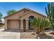 Charming home with a desert-landscaped front yard and a covered entryway at 6621 S Coral Gable Dr, Chandler, AZ 85249