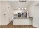 Modern kitchen features stainless steel appliances, granite countertops, and bright white cabinets at 6621 S Coral Gable Dr, Chandler, AZ 85249