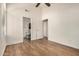 Bright main bedroom with wood floors and adjacent bathroom at 6621 S Coral Gable Dr, Chandler, AZ 85249