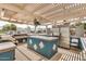 Covered outdoor kitchen featuring a grill, food prep space, and stainless steel refrigerator at 6621 S Coral Gable Dr, Chandler, AZ 85249