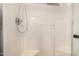 Enclosed shower featuring a mounted shower head and grab bar at 6621 S Coral Gable Dr, Chandler, AZ 85249