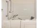 Walk-in tub with safety grab bars and multiple shower heads at 6621 S Coral Gable Dr, Chandler, AZ 85249