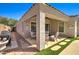 Charming back patio featuring a grill, seating area, and low-maintenance turf at 709 E Dry Creek Rd, San Tan Valley, AZ 85143