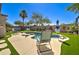 Resort-style backyard featuring pool with waterfall and low-maintenance landscaping at 709 E Dry Creek Rd, San Tan Valley, AZ 85143