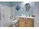Bathroom features blue walls, a nautical theme, and a shower/tub combination at 709 E Dry Creek Rd, San Tan Valley, AZ 85143
