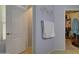 Bright bathroom with a walk-in closet, towel rack, and tan tile flooring at 709 E Dry Creek Rd, San Tan Valley, AZ 85143