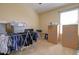 Spare bedroom showing clothes rack and boxes at 709 E Dry Creek Rd, San Tan Valley, AZ 85143