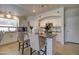 Bright kitchen with an island, chic counter stools, and modern stainless steel appliances at 709 E Dry Creek Rd, San Tan Valley, AZ 85143
