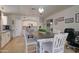 Well-lit eat-in kitchen with an island, stainless steel appliances, and white cabinetry at 709 E Dry Creek Rd, San Tan Valley, AZ 85143