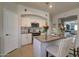 Charming kitchen featuring white cabinets, stylish backsplash, and modern stainless steel appliances at 709 E Dry Creek Rd, San Tan Valley, AZ 85143