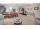 Open-concept living and dining area showcasing an elegant chandelier, artwork, and comfortable seating at 709 E Dry Creek Rd, San Tan Valley, AZ 85143