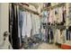 Spacious walk-in closet with plenty of storage and clothing racks at 709 E Dry Creek Rd, San Tan Valley, AZ 85143