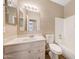 Bathroom featuring a single vanity with granite countertop, toilet, and tub with shower at 742 E Kyle Dr, Gilbert, AZ 85296