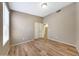 Bedroom with wood-look floors, light-colored walls, and closet with sliding doors at 742 E Kyle Dr, Gilbert, AZ 85296