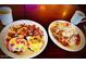 Two plates of beautifully arranged breakfast dishes with eggs, potatoes, and fresh ingredients at 742 E Kyle Dr, Gilbert, AZ 85296