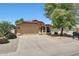 Lovely single-story home with neutral exterior, tiled roof, and mature landscaping on a sunny day at 742 E Kyle Dr, Gilbert, AZ 85296