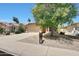 Appealing single-story residence with a two-car garage, desert landscaping, and a tiled roof at 742 E Kyle Dr, Gilbert, AZ 85296