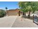 Beautiful single-story house with a two-car garage, desert landscaping, and a tiled roof at 742 E Kyle Dr, Gilbert, AZ 85296