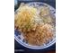 Plate of rolled tacos covered with cheese and guacamole served with rice and beans at 742 E Kyle Dr, Gilbert, AZ 85296