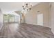Open living room with vaulted ceilings and plentiful natural light showcases wood-look floors at 742 E Kyle Dr, Gilbert, AZ 85296