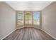 Cozy room with large arched windows and modern wood-look flooring at 742 E Kyle Dr, Gilbert, AZ 85296