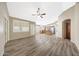Spacious open concept living room with wood-look flooring and abundant natural light at 742 E Kyle Dr, Gilbert, AZ 85296