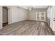 Neutral living room featuring vaulted ceiling, ceiling fan, and French doors at 742 E Kyle Dr, Gilbert, AZ 85296