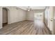 Living room featuring vaulted ceiling and view to porch with plantation shutters at 742 E Kyle Dr, Gilbert, AZ 85296