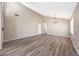 Spacious living room with wood-look flooring and high ceilings, perfect for entertaining at 742 E Kyle Dr, Gilbert, AZ 85296