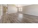 Bright, spacious living room featuring a chandelier and wood-look flooring at 742 E Kyle Dr, Gilbert, AZ 85296