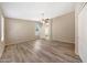 Spacious primary bedroom features wood-look floors, several windows, and ceiling fan at 742 E Kyle Dr, Gilbert, AZ 85296