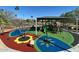 Colorful playground with various play structures, a shade canopy, and a soft rubber surface at 742 E Kyle Dr, Gilbert, AZ 85296