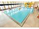 Indoor community pool with a giant yellow water slide in the back at 742 E Kyle Dr, Gilbert, AZ 85296