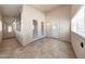 Enclosed porch area with tile flooring and abundant natural light at 742 E Kyle Dr, Gilbert, AZ 85296
