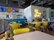 Restaurant interior featuring vibrant yellow chairs and a cozy atmosphere at 742 E Kyle Dr, Gilbert, AZ 85296