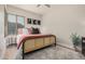 Comfortable bedroom featuring wood floors, stylish decor, and a soft rug at 7887 N 16Th St # 224, Phoenix, AZ 85020