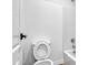 A bright white bathroom featuring a toilet next to the shower and bathtub combo at 8137 W Pueblo Ave, Phoenix, AZ 85043