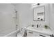 Bright bathroom with white tiling, shower and a vanity at 8137 W Pueblo Ave, Phoenix, AZ 85043