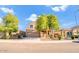 Two-story home featuring a well-manicured front yard and covered porch at 8137 W Pueblo Ave, Phoenix, AZ 85043