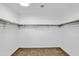 A walk-in closet with shelves and space for hanging clothes, offering practical storage at 8137 W Pueblo Ave, Phoenix, AZ 85043